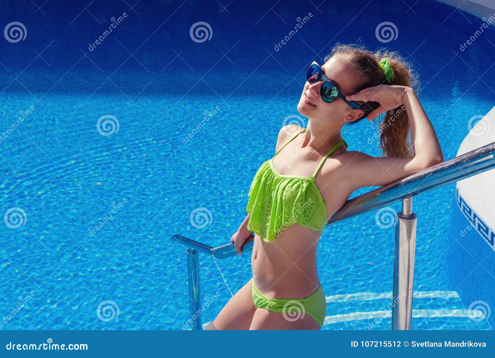 Teen Girl Relaxing Near Swimming Pool Stock Photo - Image of female, cute:  107215512