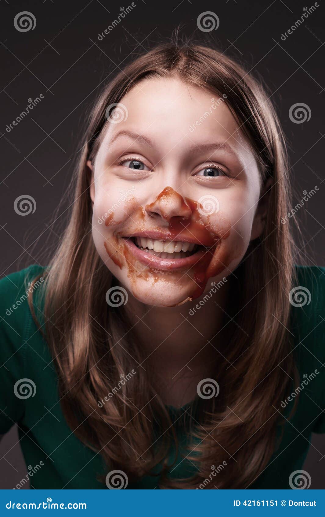 Teen Girl Sitting And Laughing