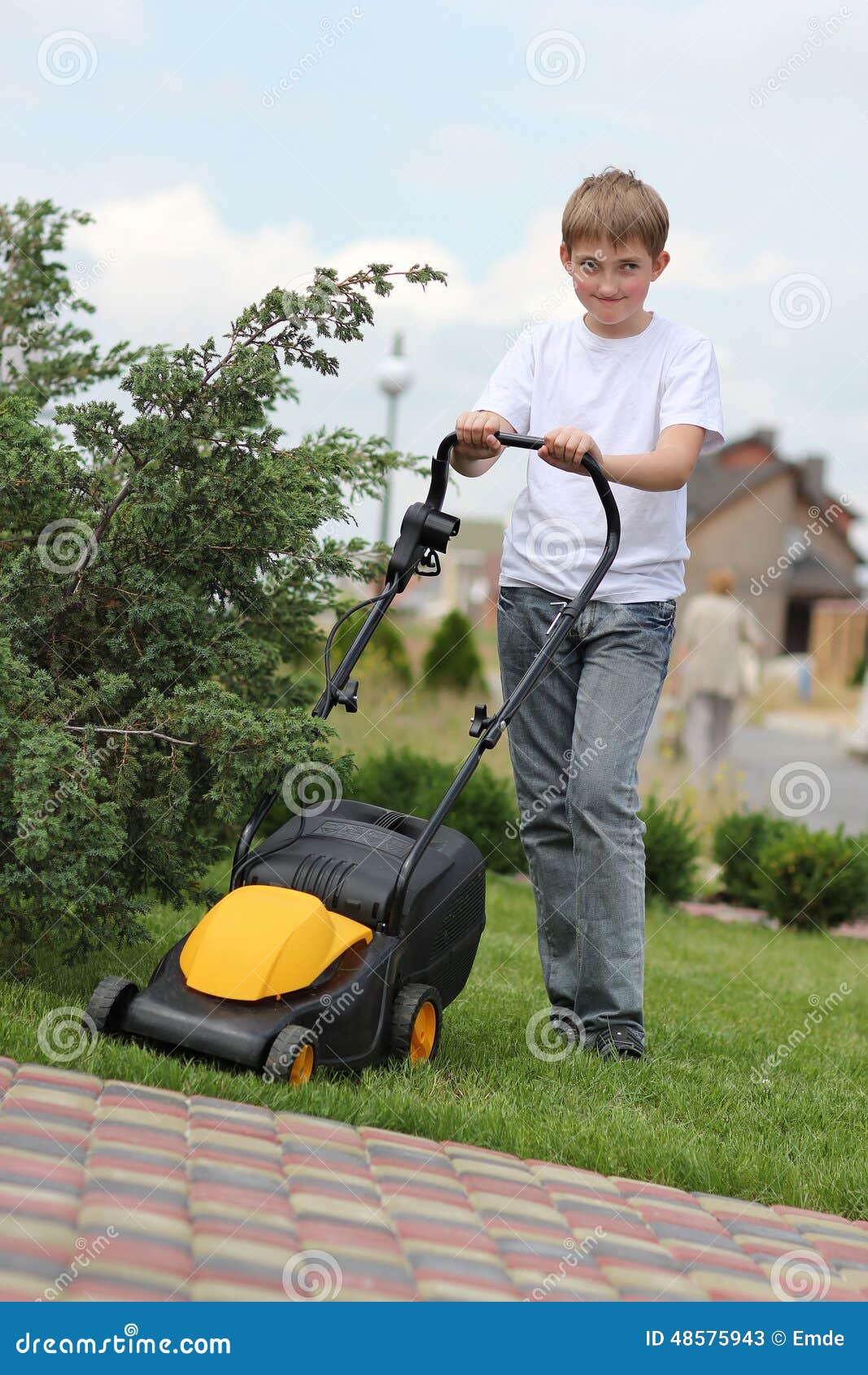 Teen Son Helps Mother Clean Weeds In Garden Beds Royalty Free Stock