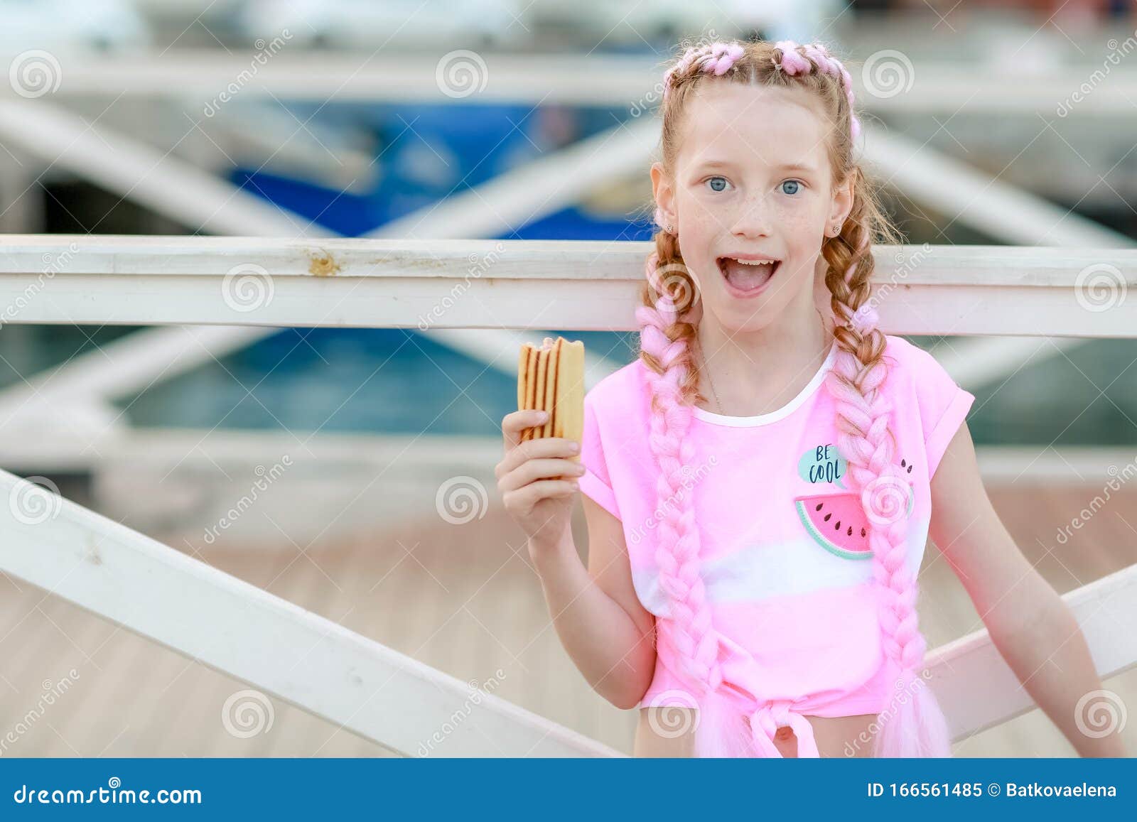 Teen Schoolgirl Girl With Pigtails Close Up Eating Ice Cream In Summer