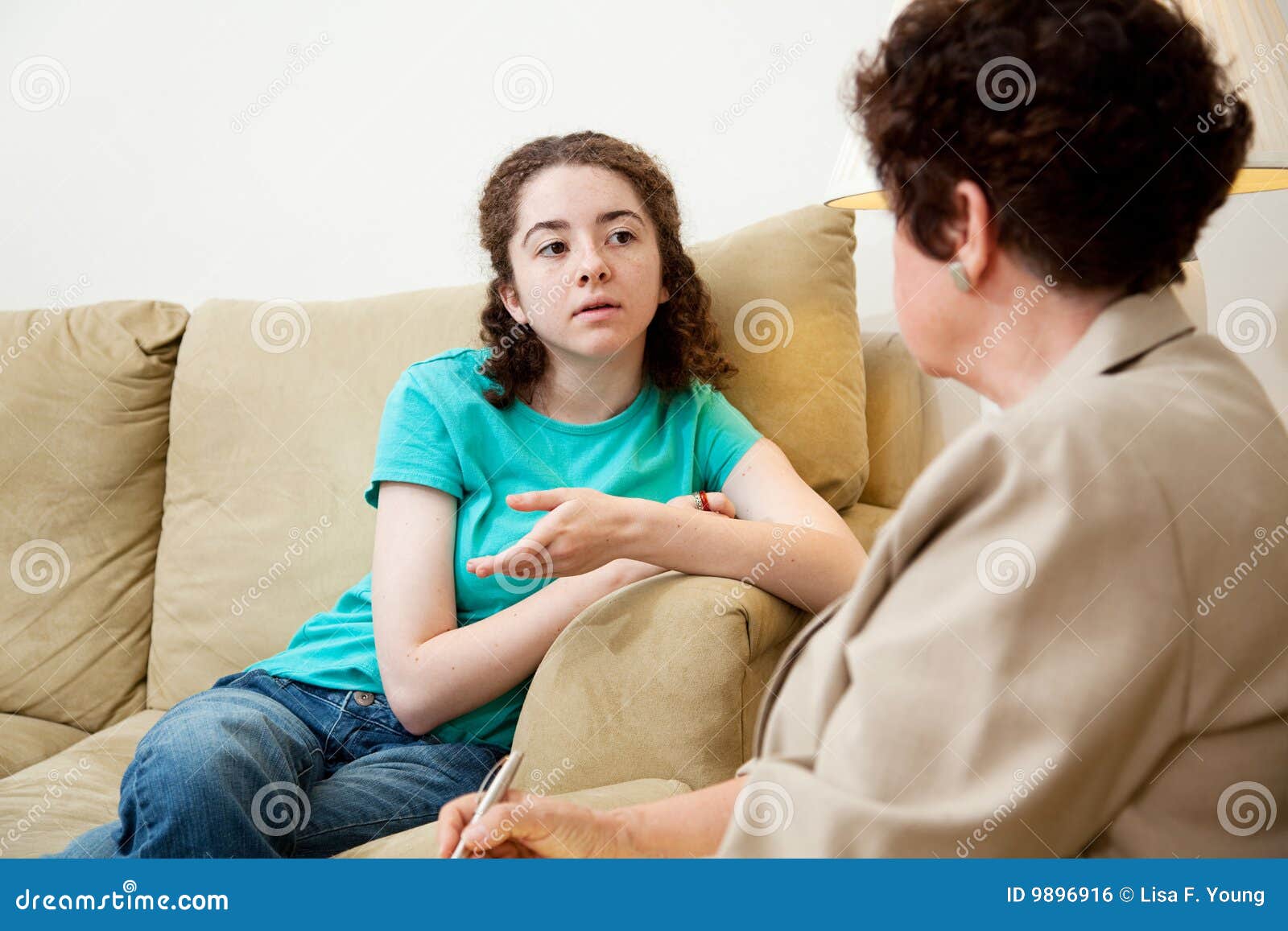 teen speaking with counselor