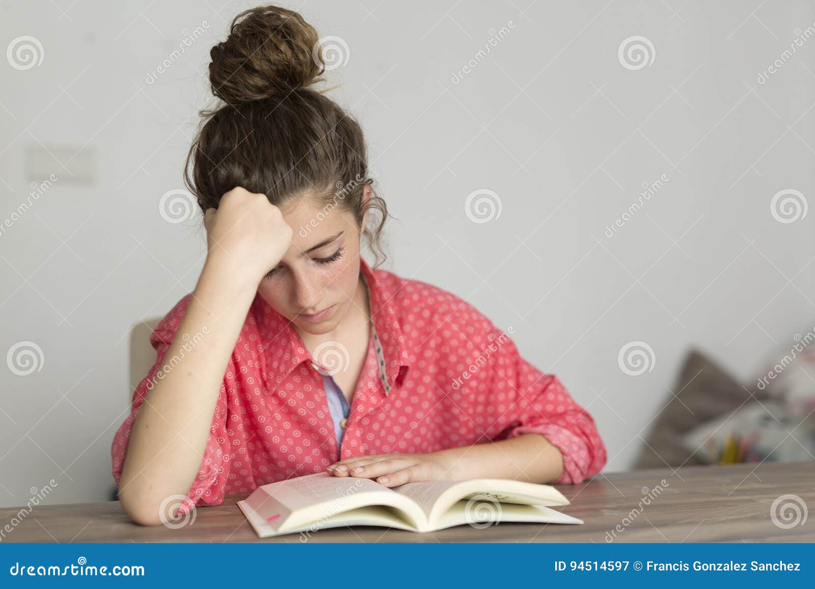 teen woman reading a book.