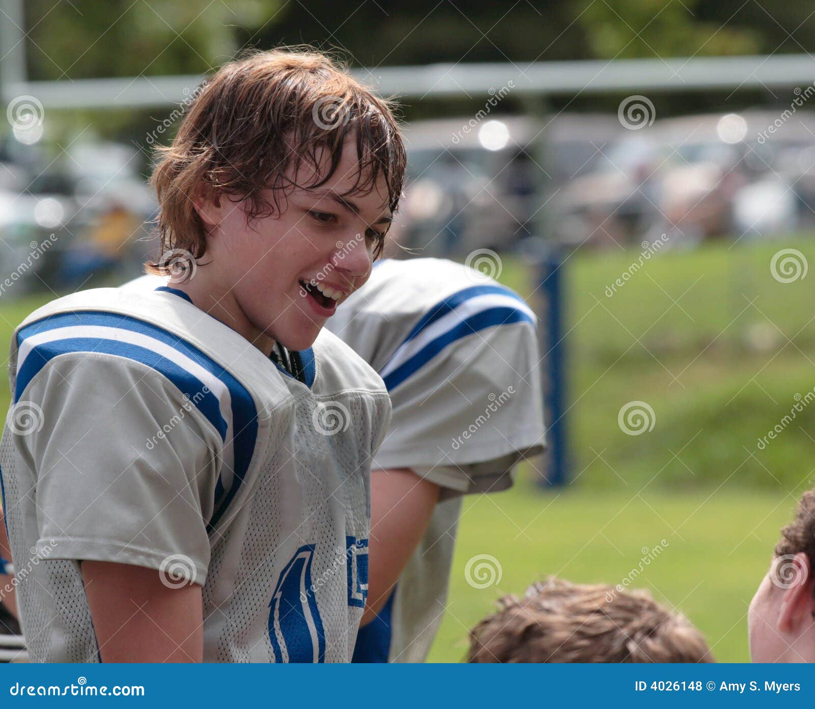 teen youth football talking with teammates