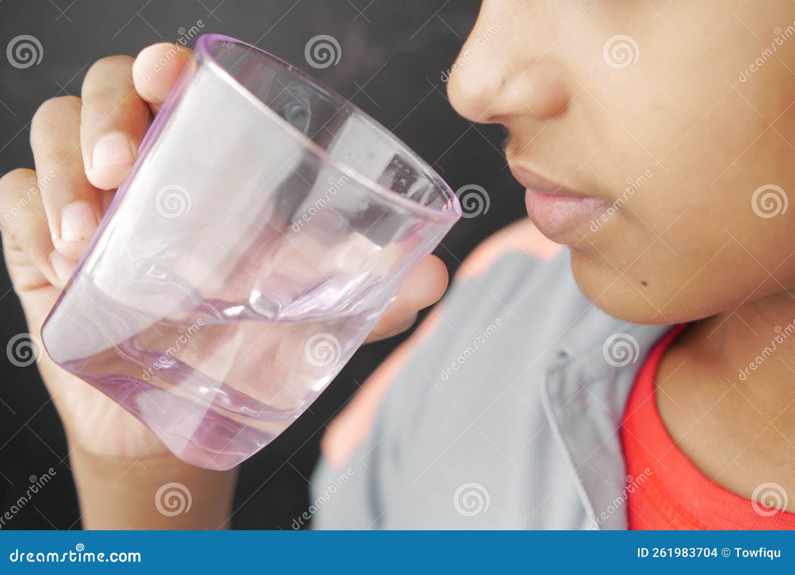 Teen Boy 12-14 Year Old Drinking Fresh Water From A Bottle. Student Teenager  With Headphones And Sunglasses Posing Outdoors. Stock Photo, Picture and  Royalty Free Image. Image 60008603.