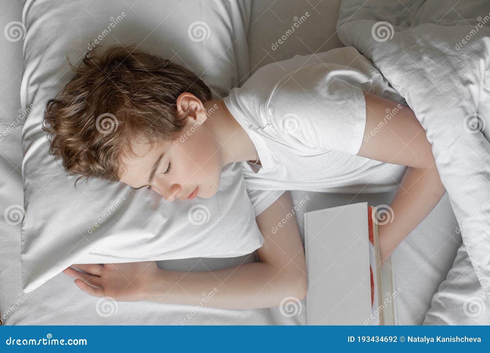 The Teenage Boy Fell Asleep with a Book in His Hand. a Boy in Bed with  White Pastel Underwear Stock Photo - Image of evening, homework: 193434692