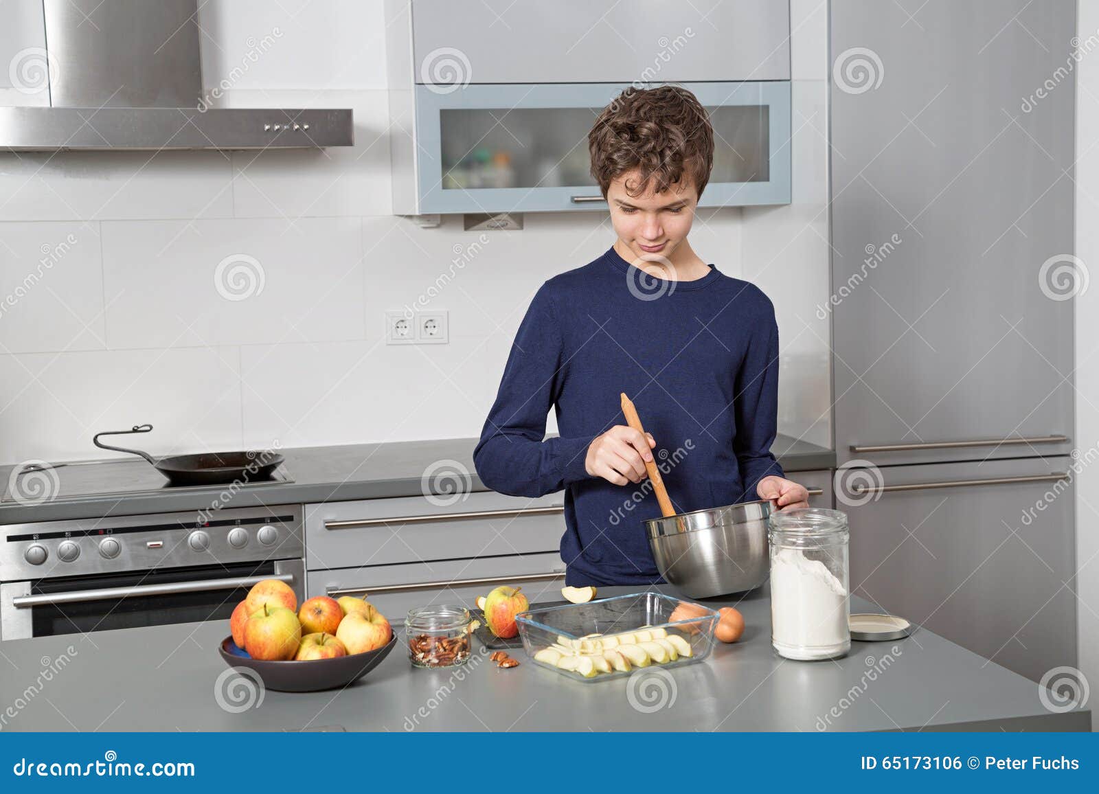 Teenage Boy in the kitchen stock photo. Image of modern 65173106
