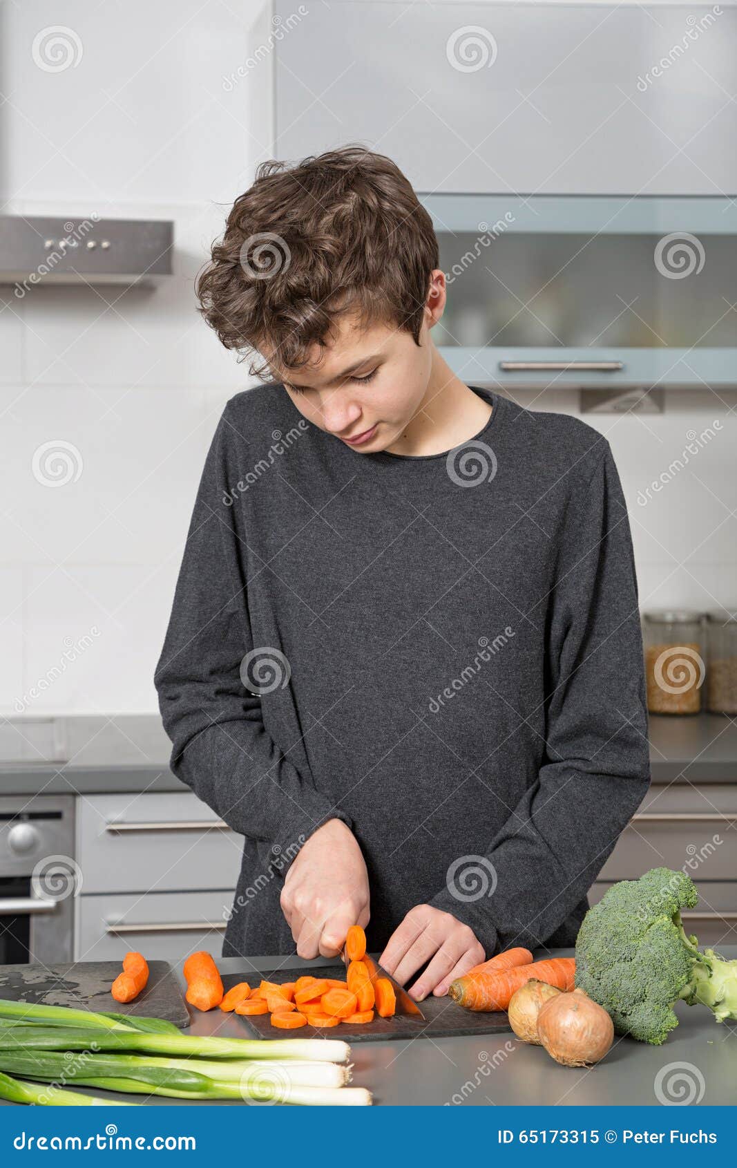 Teenage Boy in the kitchen stock image. Image of vegetable 65173315