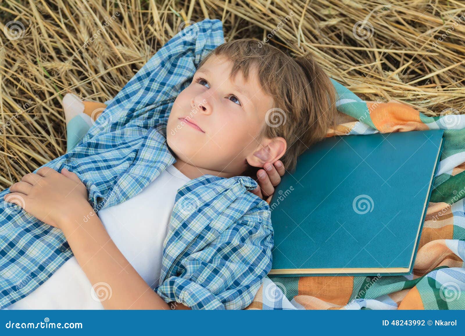 Teenage Boy Lying and Dreaming Inspired by Book Stock Photo Image of