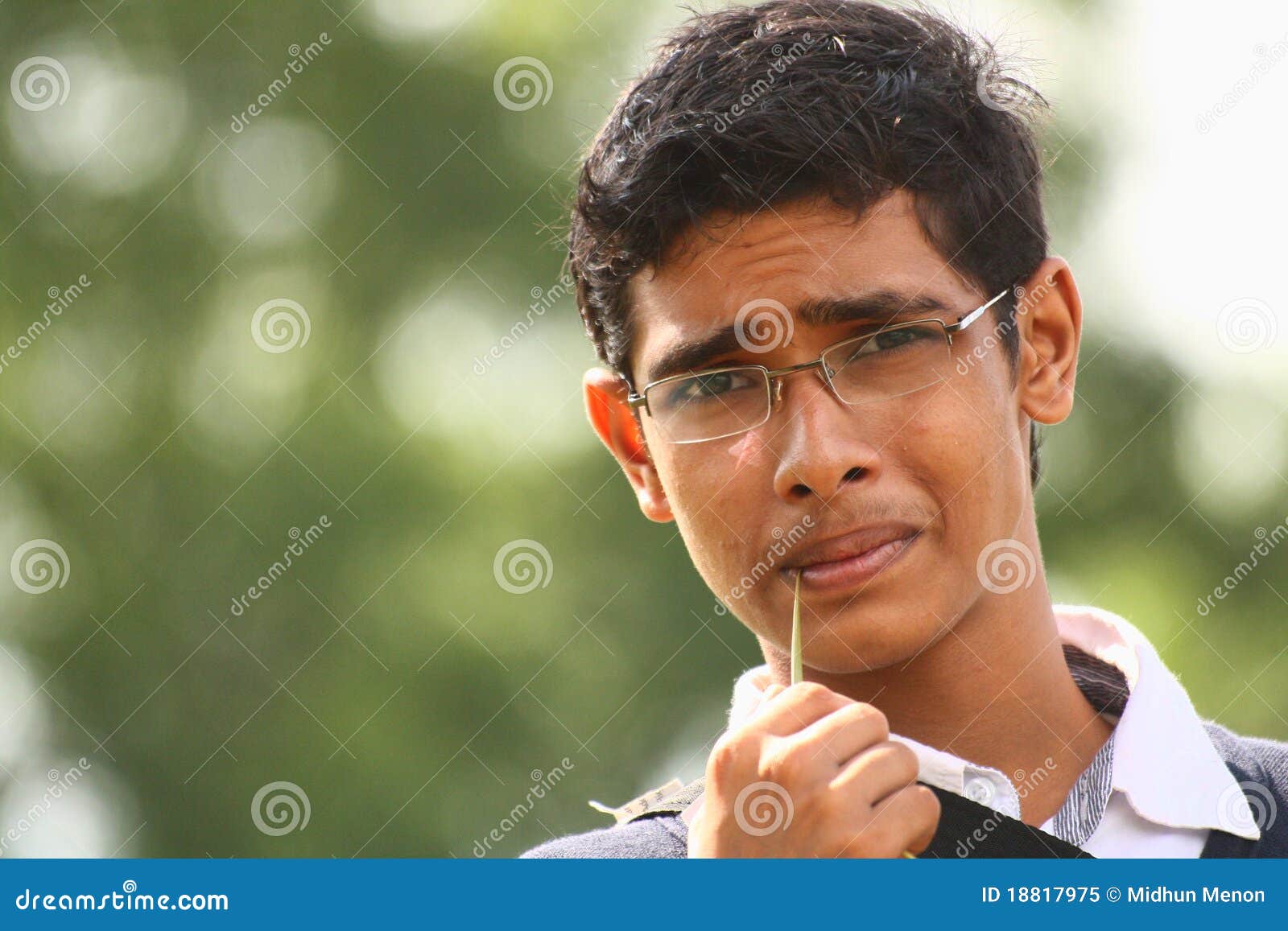 Profile of a Teenage Indian Boy Looking at outsides Stock Photo