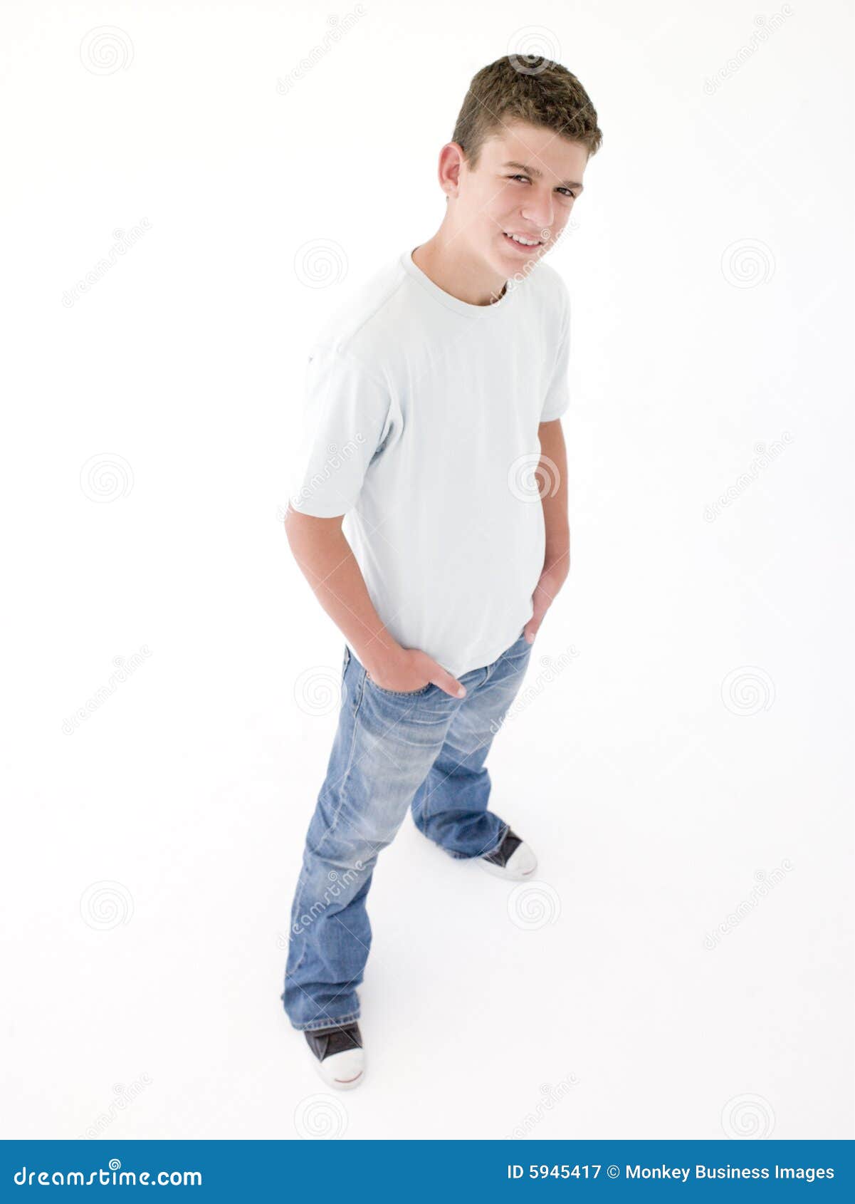 Teenage boy standing with hands in pockets — Stock Photo 