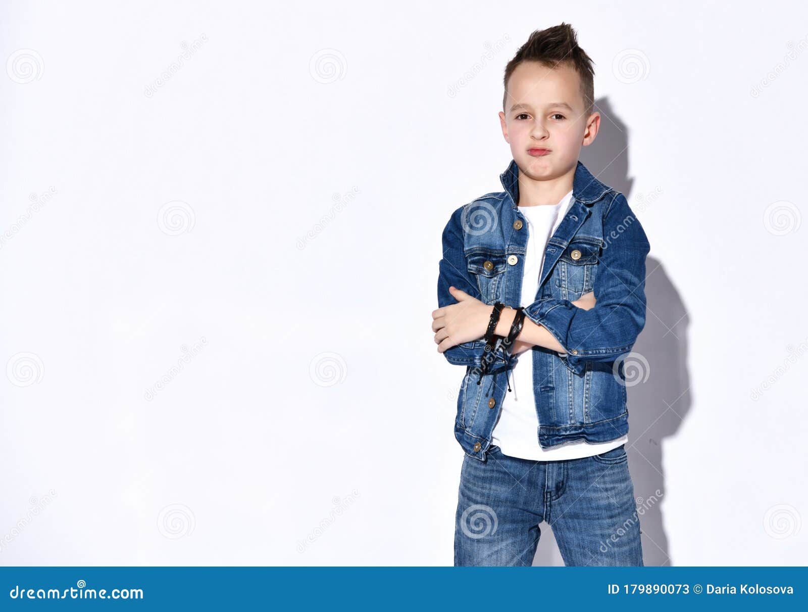 Collage set of children clothes. Denim jeans or pants, two pair shoes, a jeans  shirt, striped shirt and a sweater for child boy isolated on a white ba  Stock Photo - Alamy