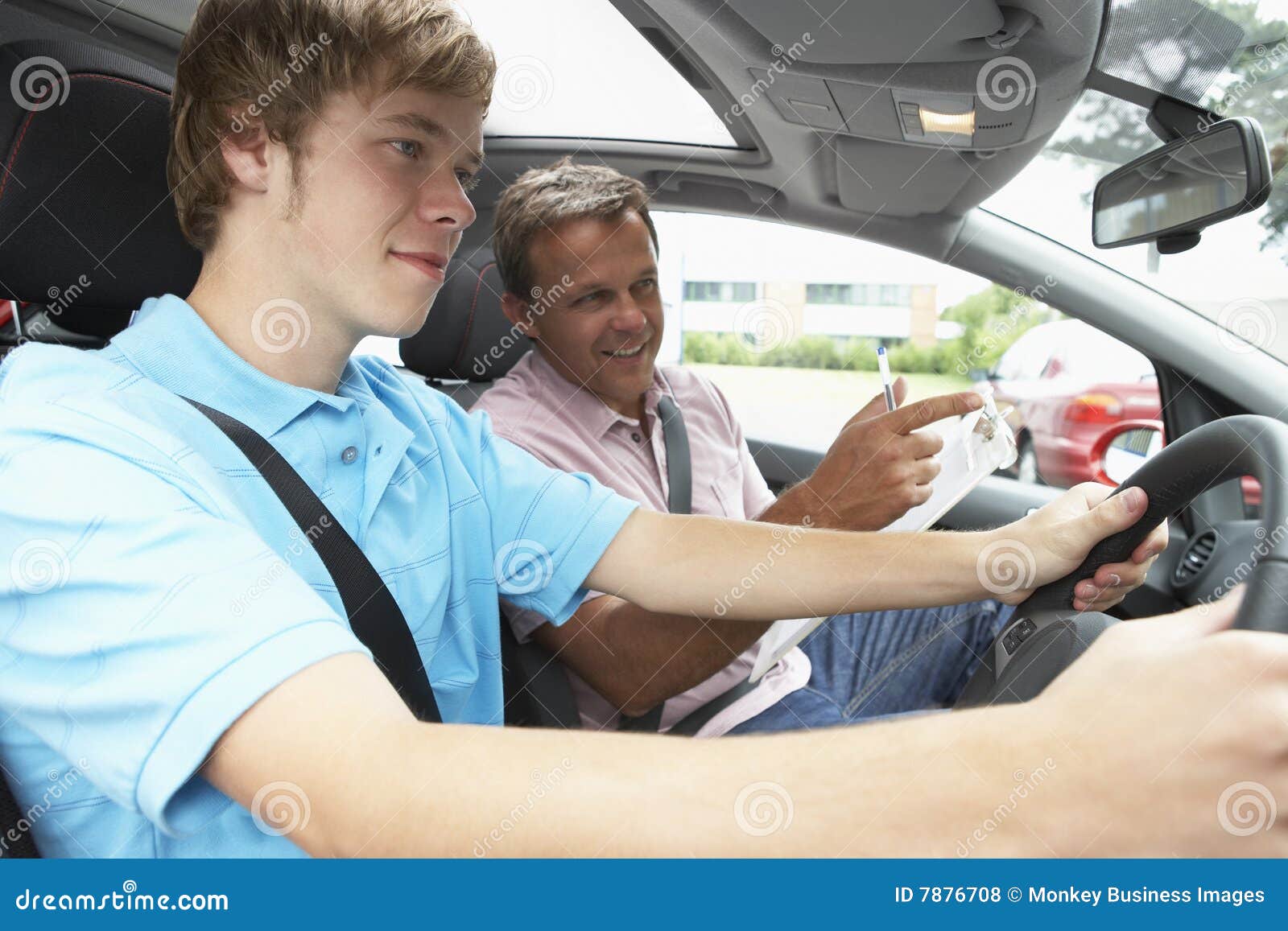 teenage boy taking a driving lesson