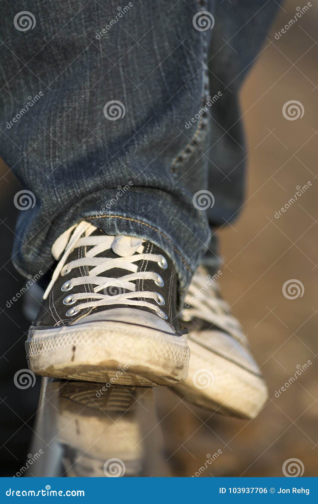 Teenage Boy Wearing Tennis Shoes Balancing on Railroad Tracks Stock ...