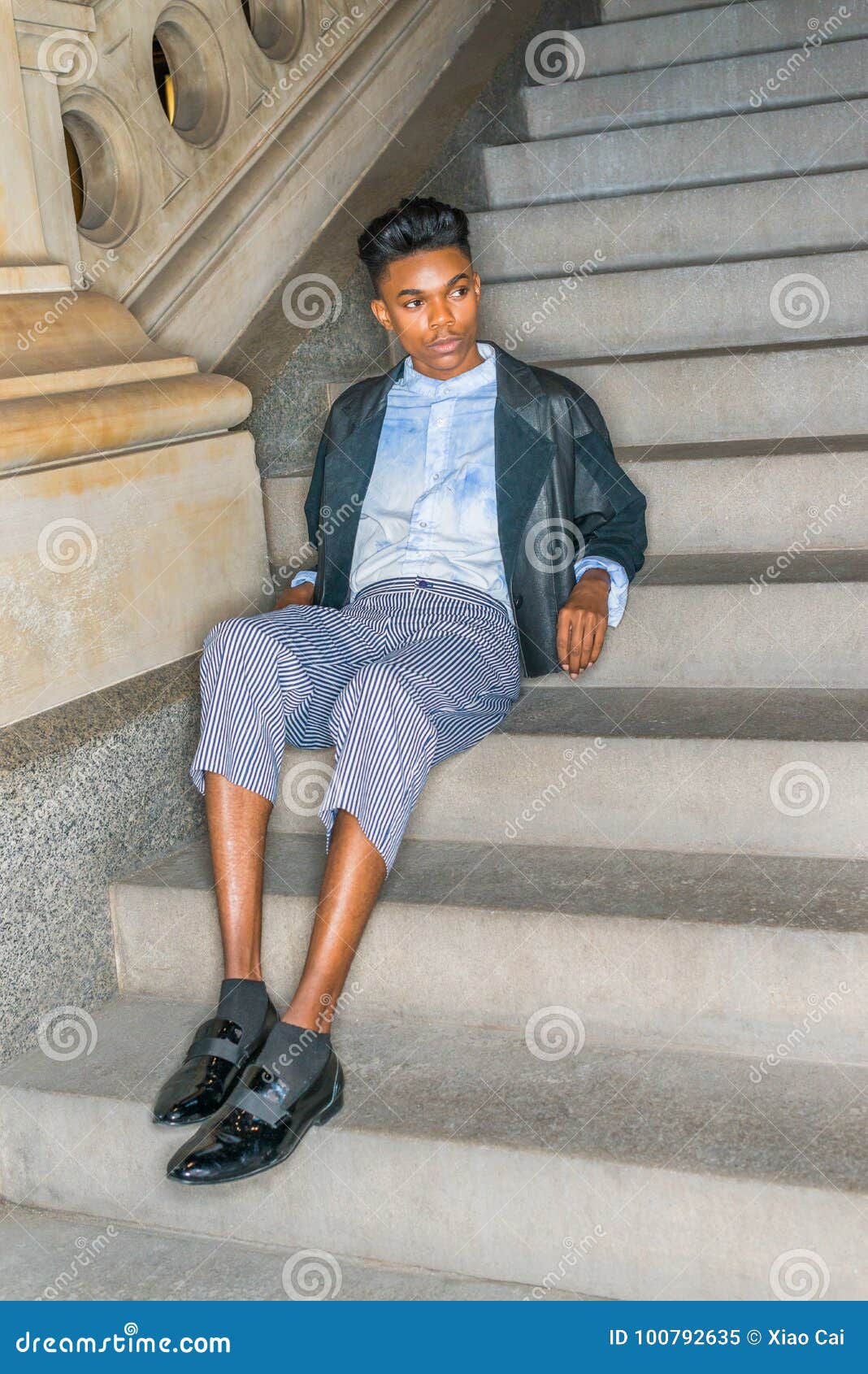 A Young Dark Skin18 Years Old Student Wearing Black Fashionable Leather Wool Mixed Jacketed Pants Blue Dyed White Shirt Leather Shoes A Young Dark Skin18 Years Old Student Wearing Black Fashionable Leather Wool Mixed Jacketed Pants Blue Dyed White Shirt Leather Shoes