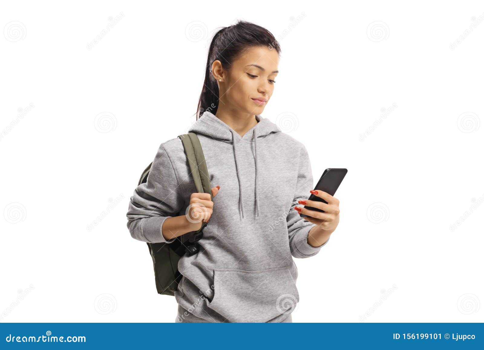 Teenage Female Student Holding a Mobile Phone and Looking at it Stock ...
