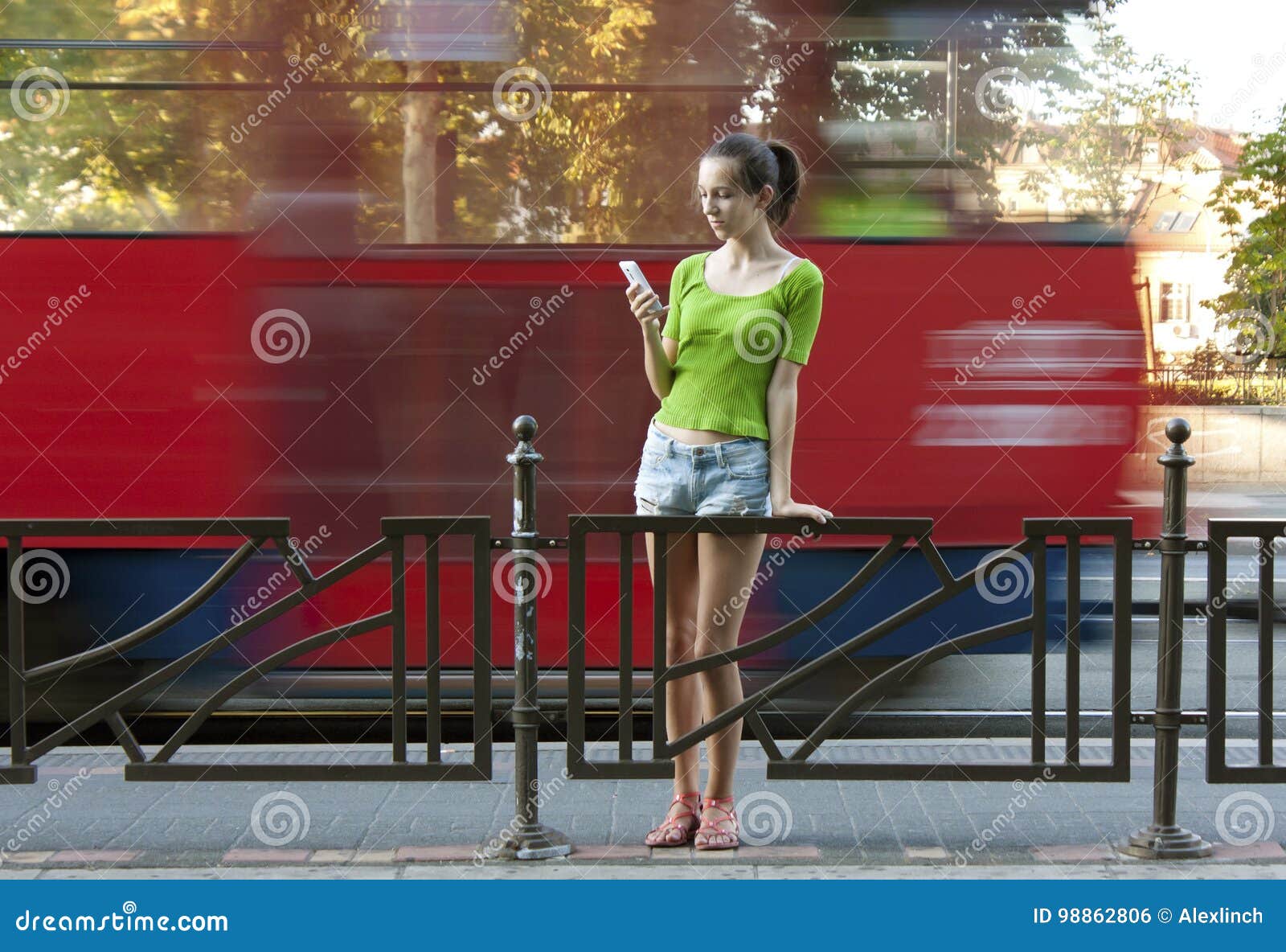 girl on bus stop stock photo. Image of shorts 98862806