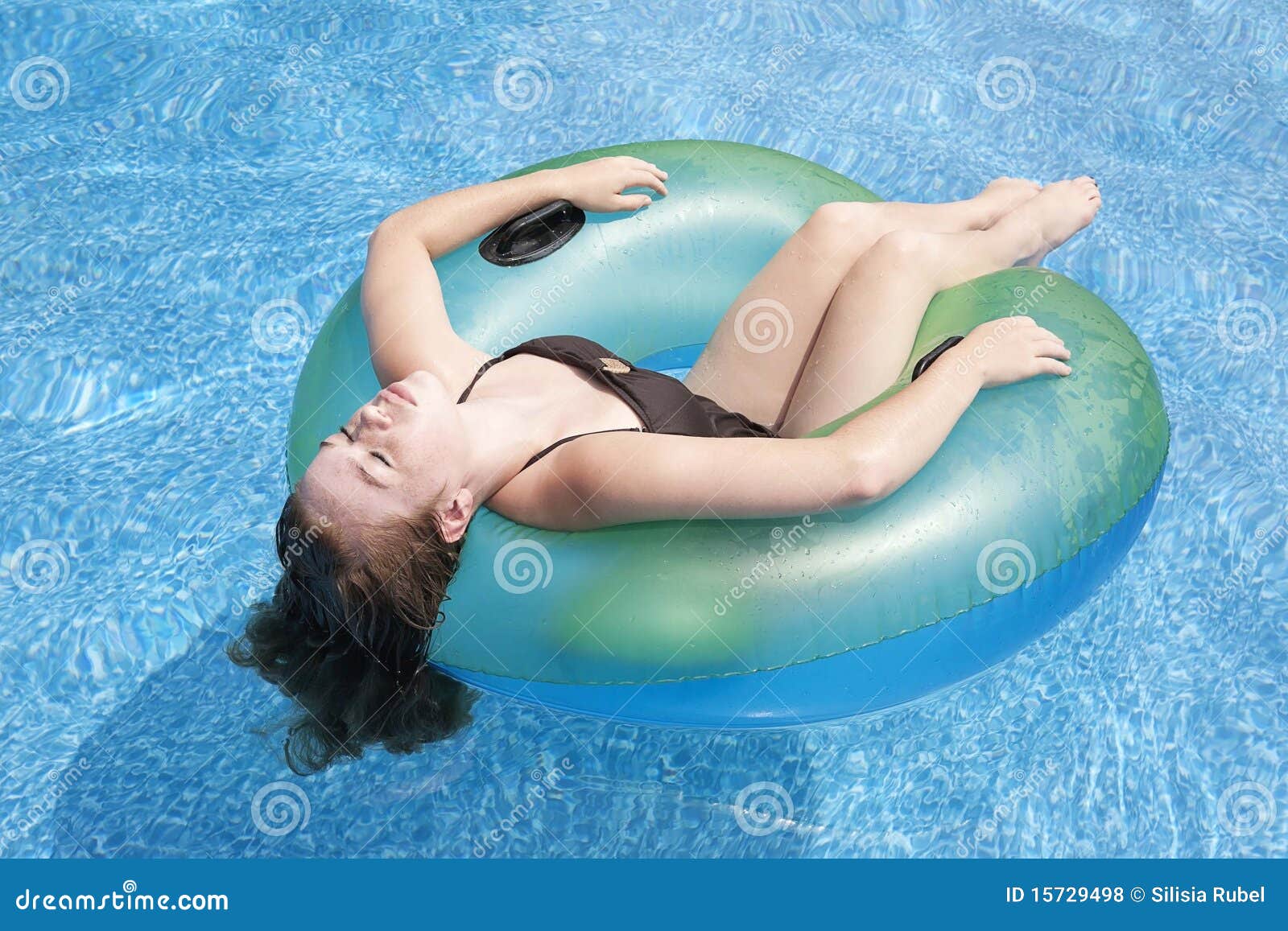 Teenage Girl Floating in Tube in Pool Stock Photo - Image of sunny, girl:  15729498