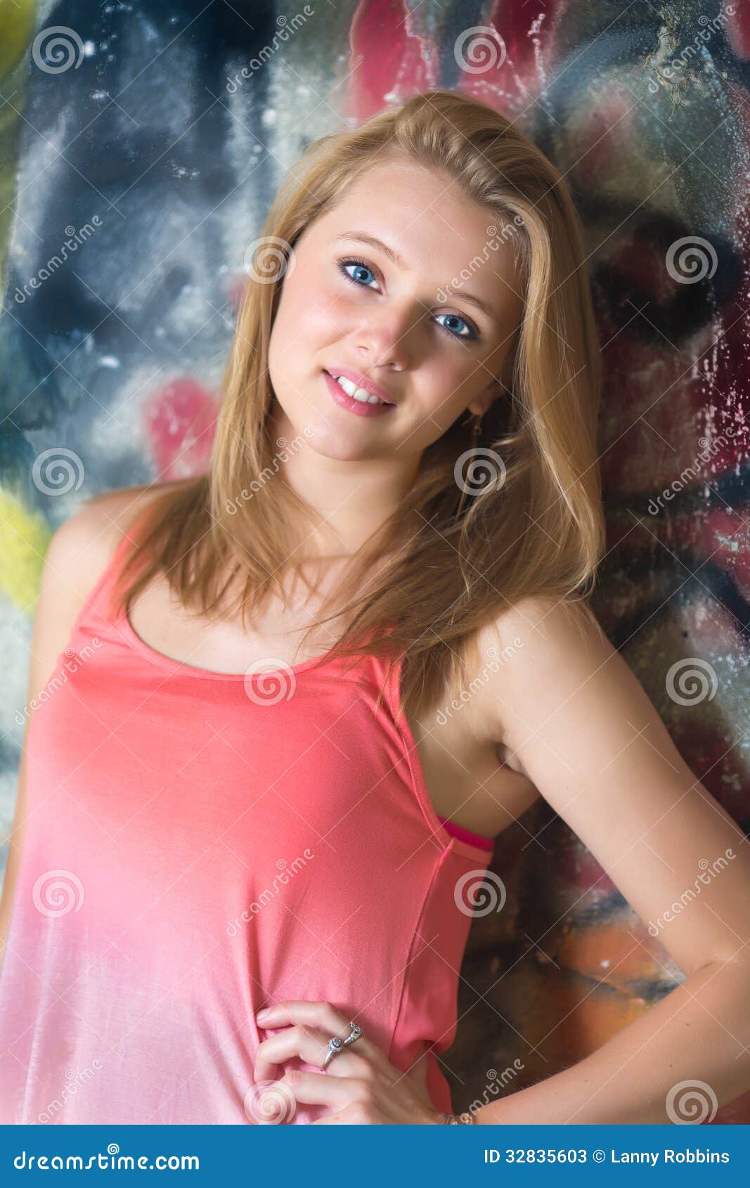 teenage-girl-graffiti-wall-background-cute-standing-front-32835603.jpg