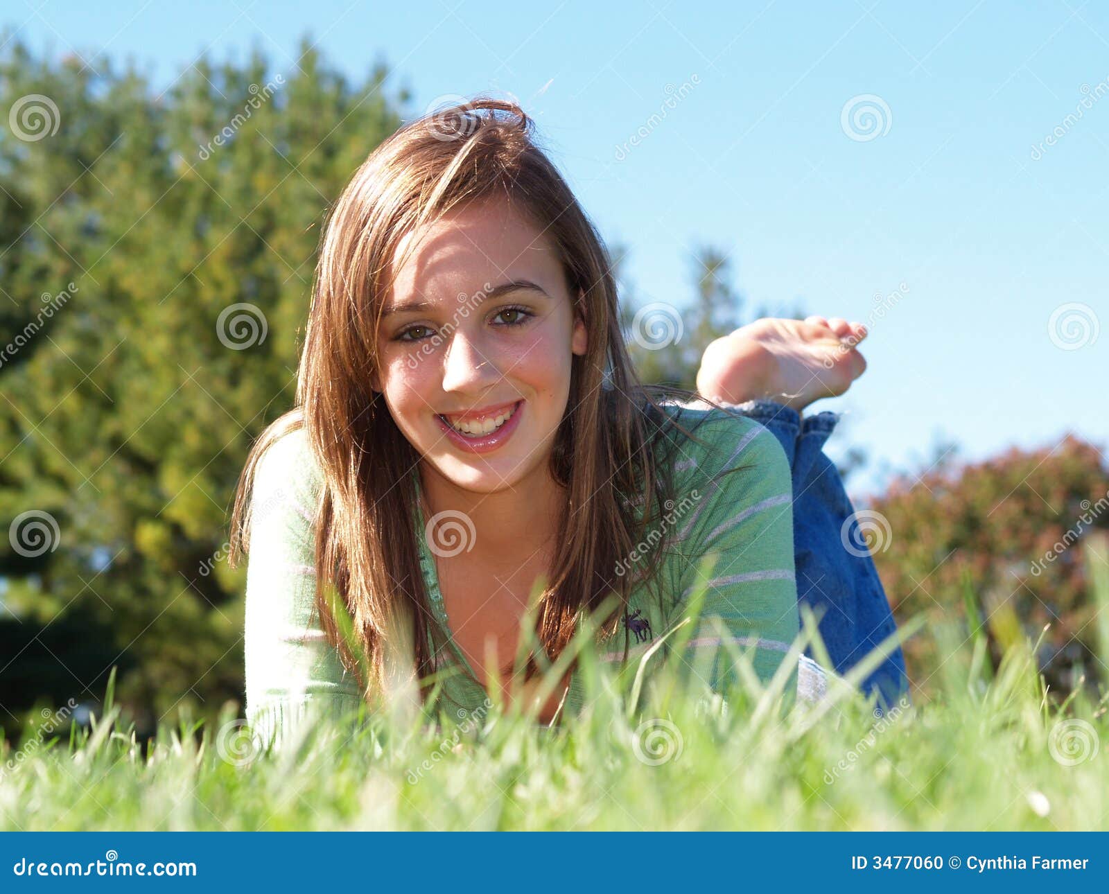 Teenage Girl Laying In Grass Stock Photo - Image: 3477060