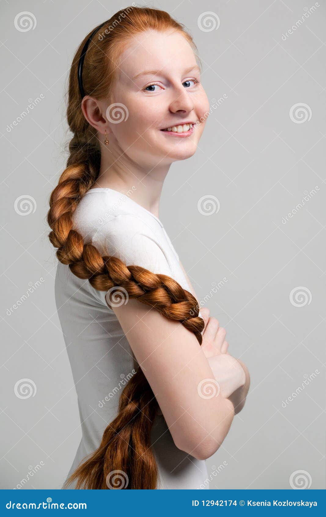 teenage girl with long red plait