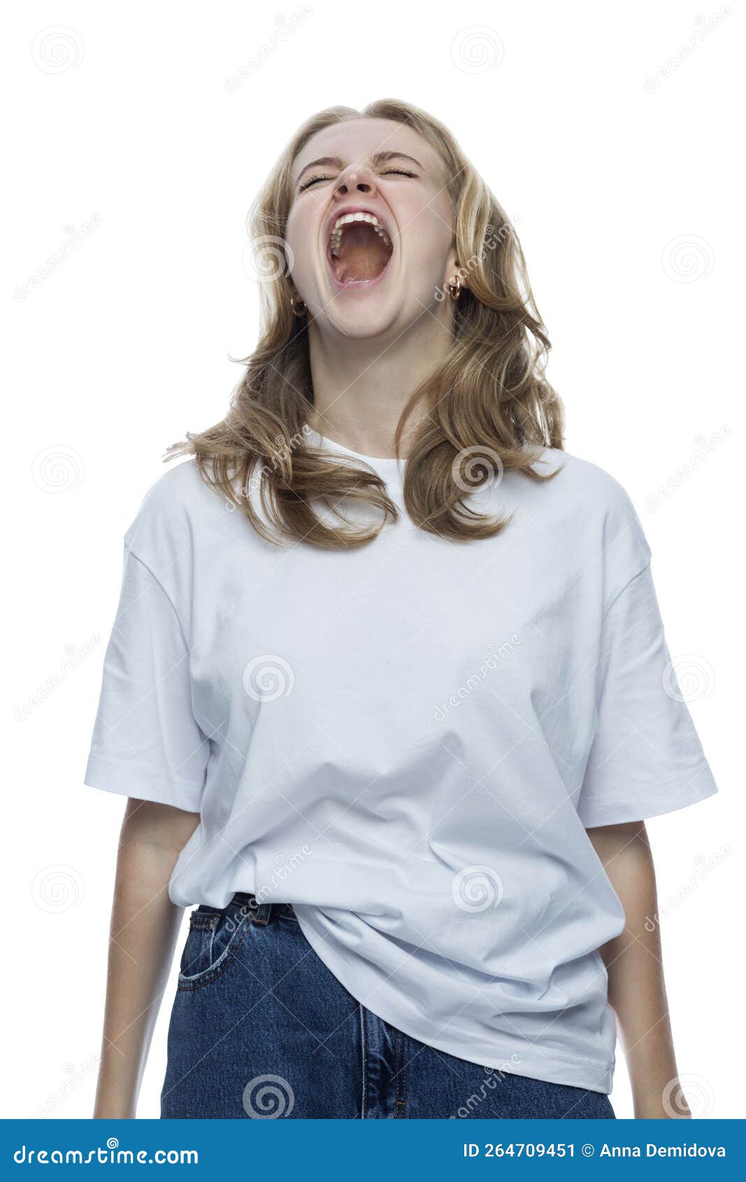 a teenage girl screams. young pretty blonde in a white t-shirt and jeans. depression and horror.  on white background.
