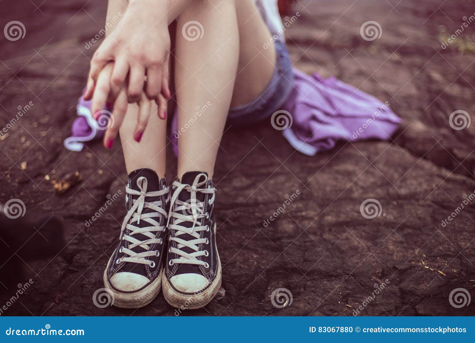 Teenage Girl Sitting On A Rock Picture. Image: 83067880