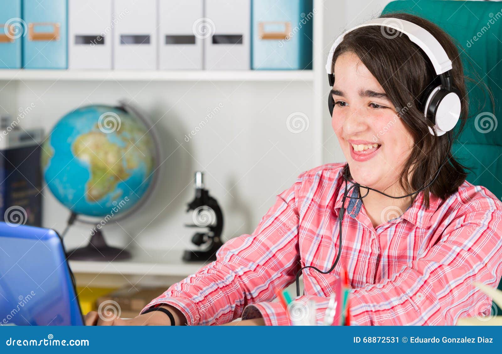 teenage girl studying at home