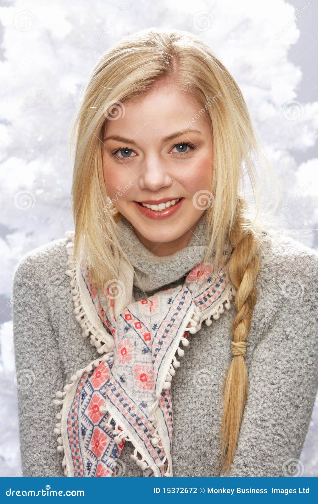 teenage girl wearing cap and knitwear in studio