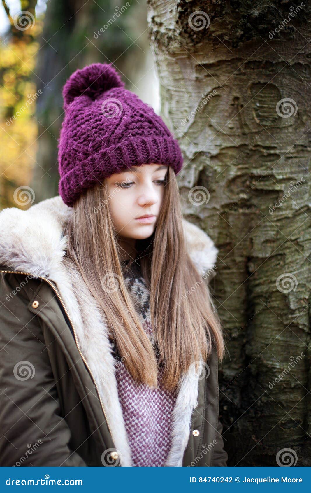 Teenage Girl Wearing a Woolen Hat Standing beside a Tree Stock Photo ...