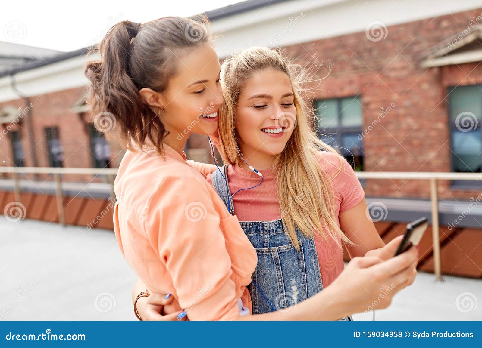 Teenage Girls Listening To Music on Smartphone Stock Photo - Image of ...
