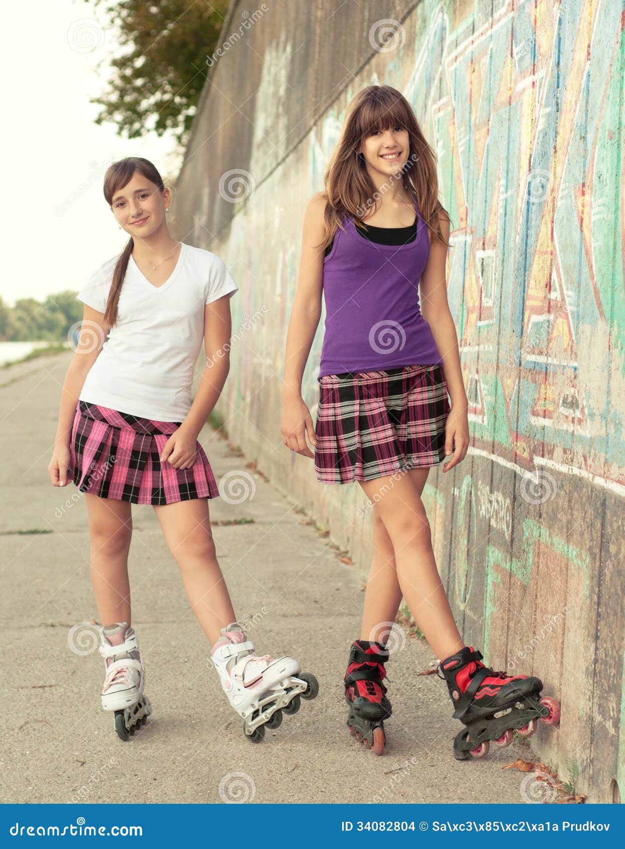 Teenage Girls On Roller Skates Having Fun Stock Photo - Image of close