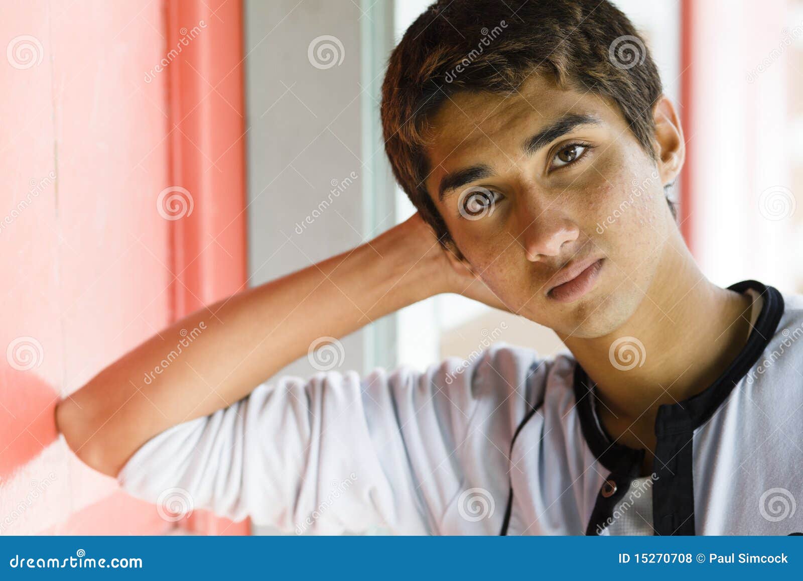 Profile of a Teenage Indian Boy Looking at outsides Stock Photo