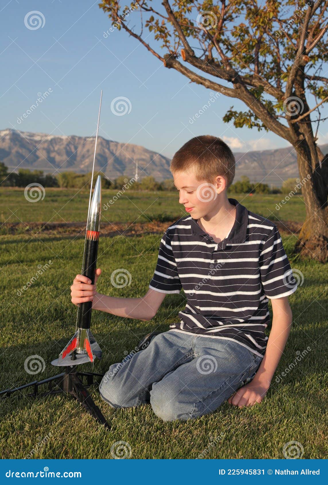Teenage Boy Launching a Model Rocket Stock Image - Image of flight