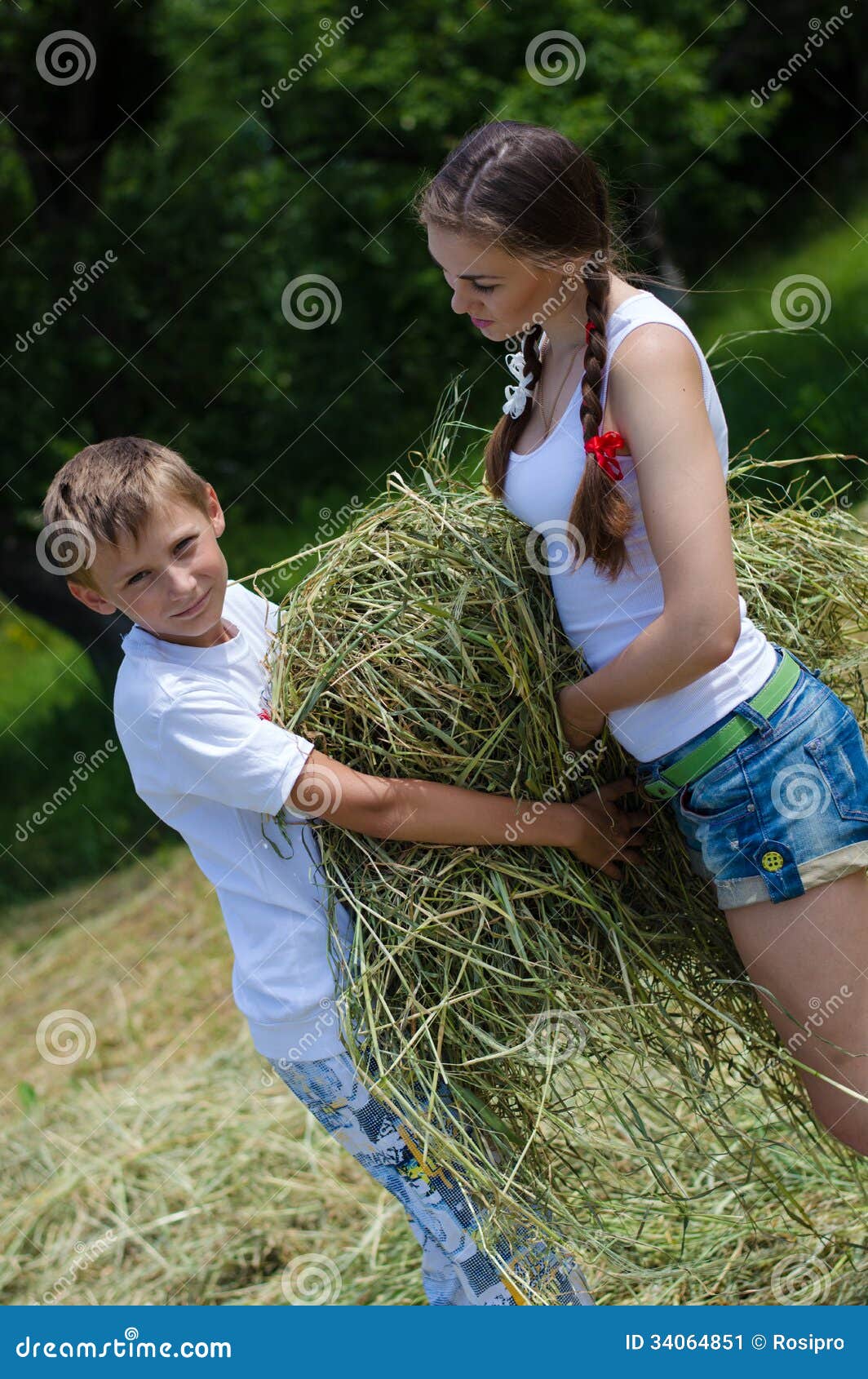 Teenage Sister And Little Brother Holding Velour Gra