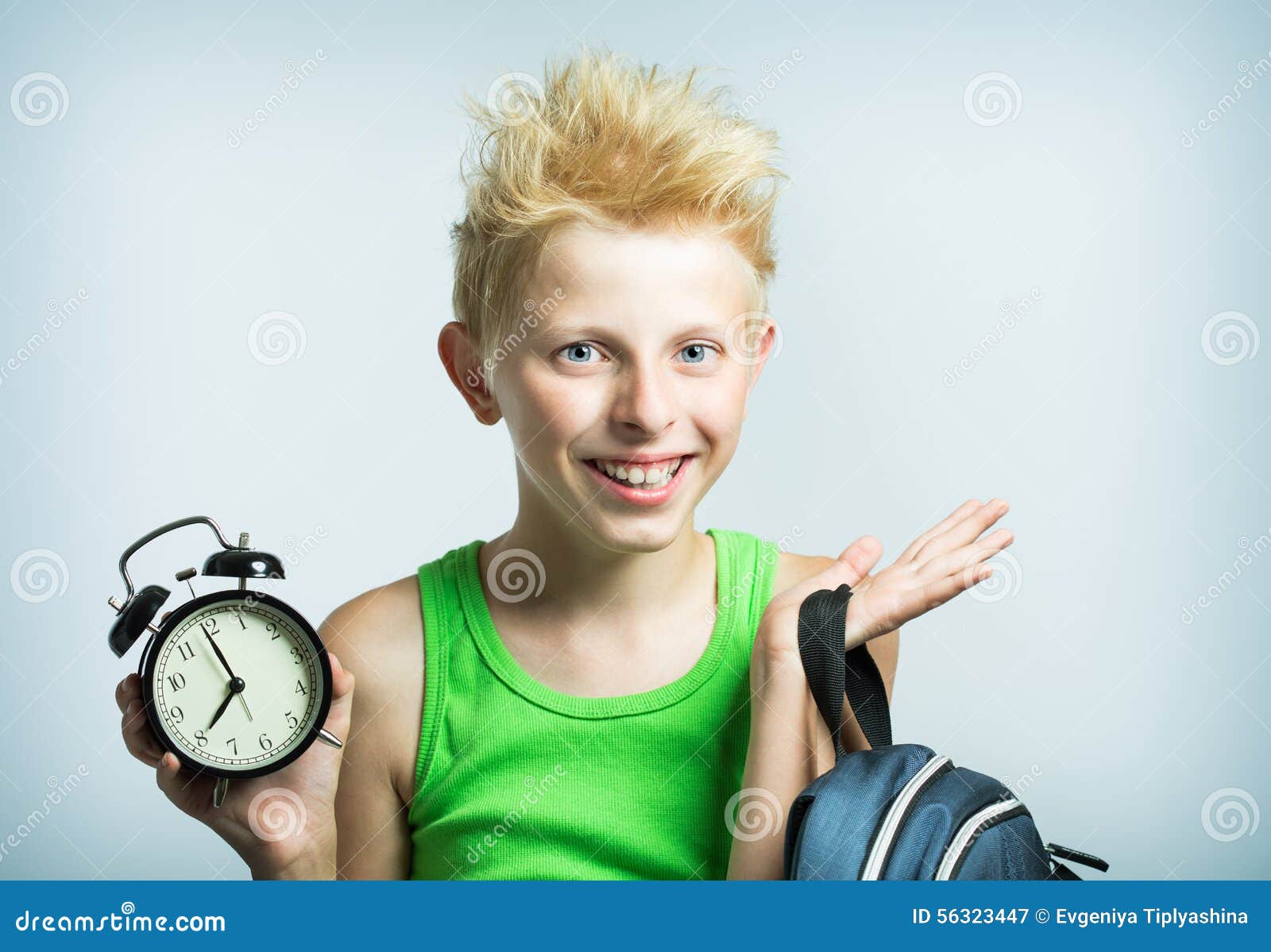 Teenager with an Alarm Clock Stock Image Image of showing, alarm 56323447