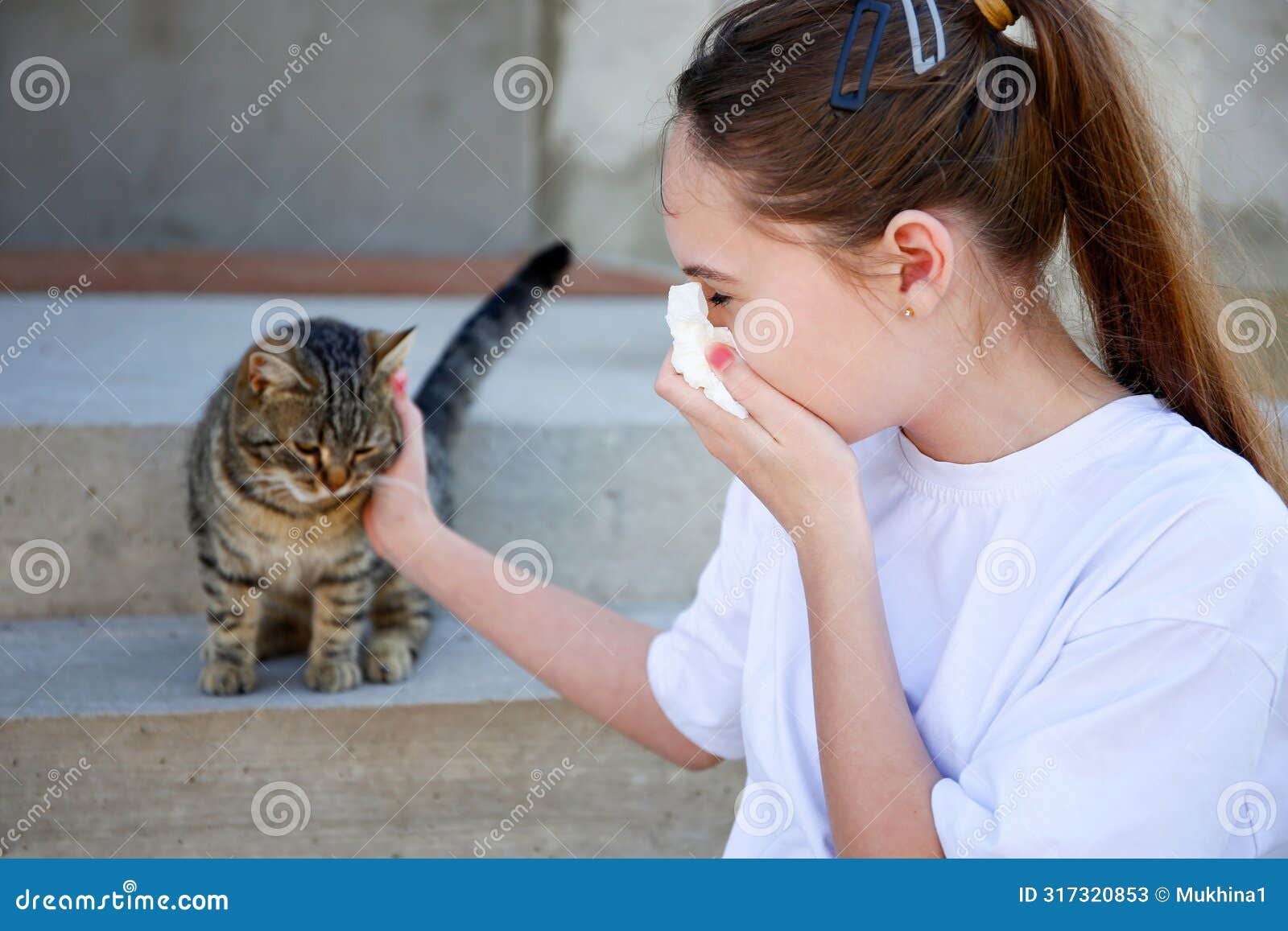 the teenager is allergic to a cat