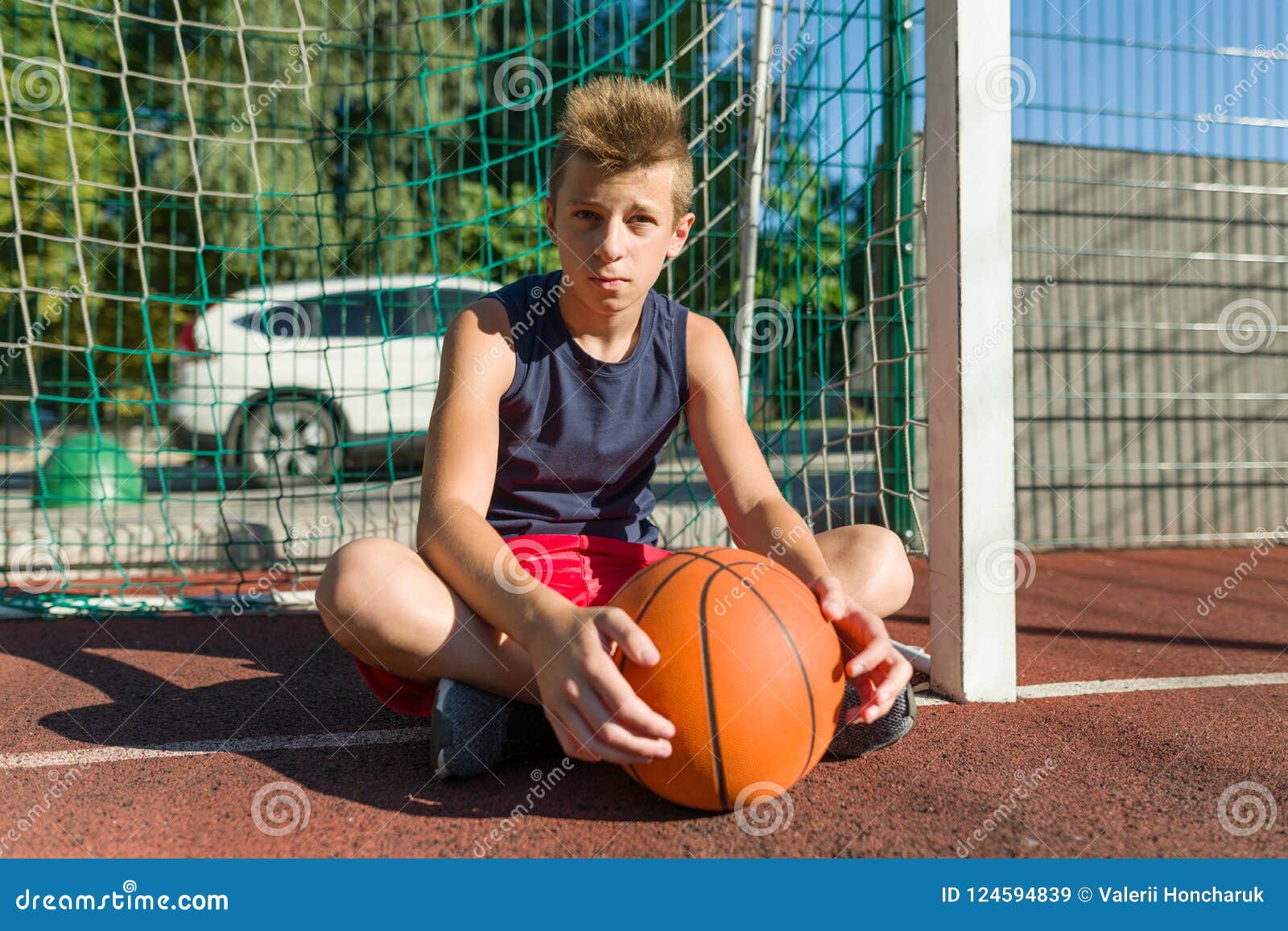 Teenager Boy Street Basketball Player on the City Basketball Court ...