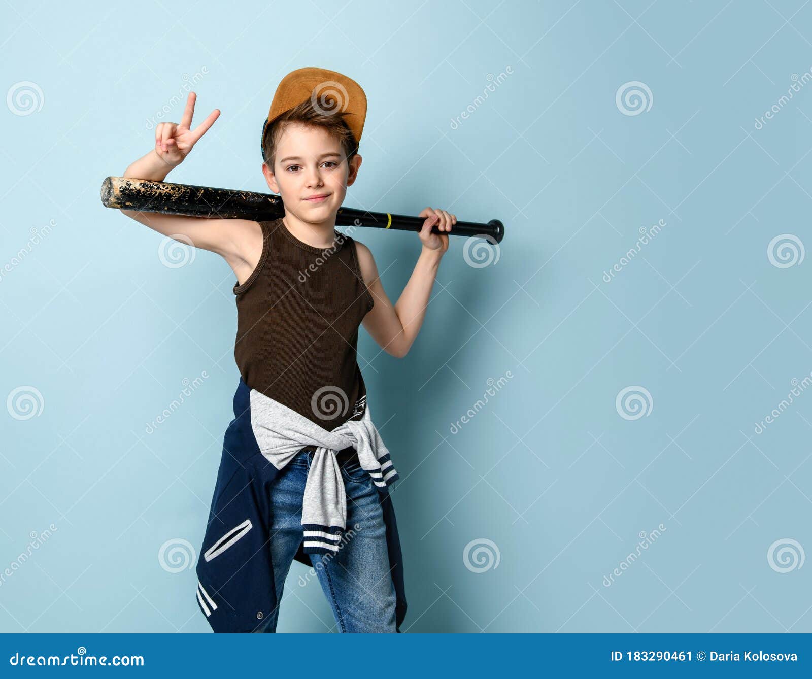 Teenager in Cap and Casual Clothes. he Holding Black Baseball Bat ...