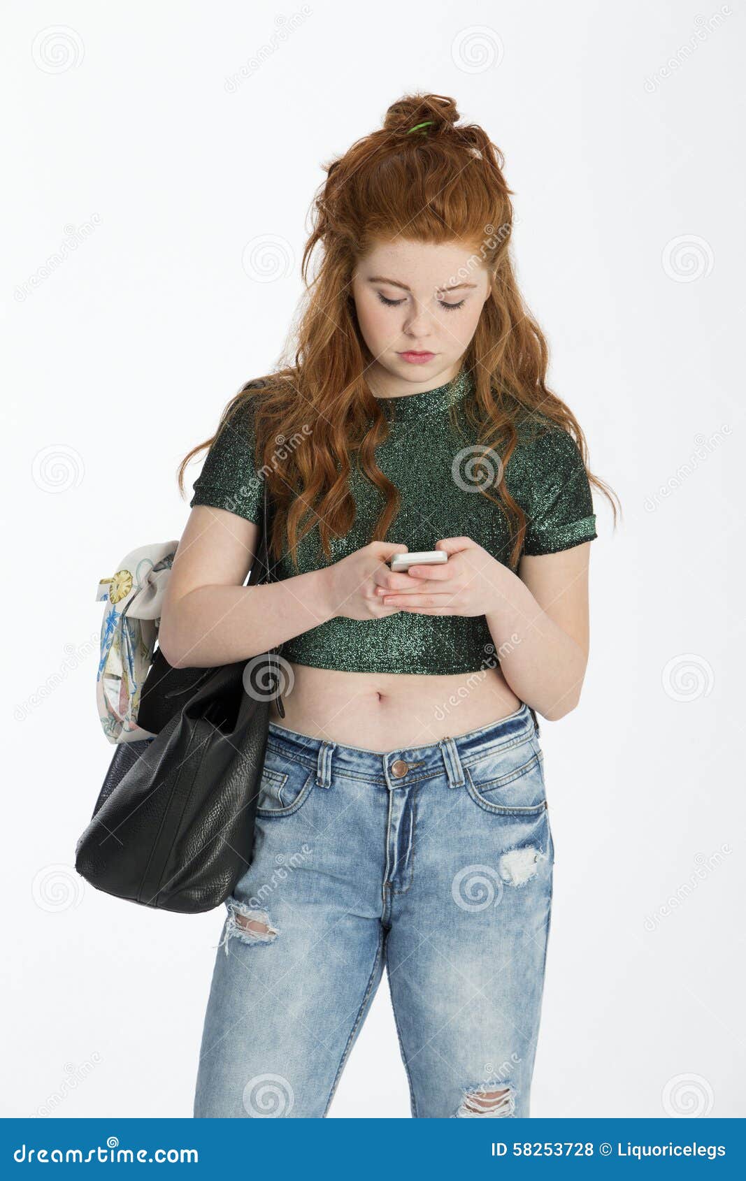 teenager engrossed in her smartphone