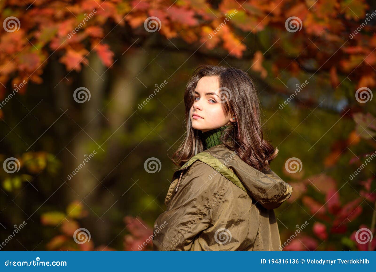 Teenager Girl on Autumn Red Maple Leaves at Fall Outdoors. Portrait of ...