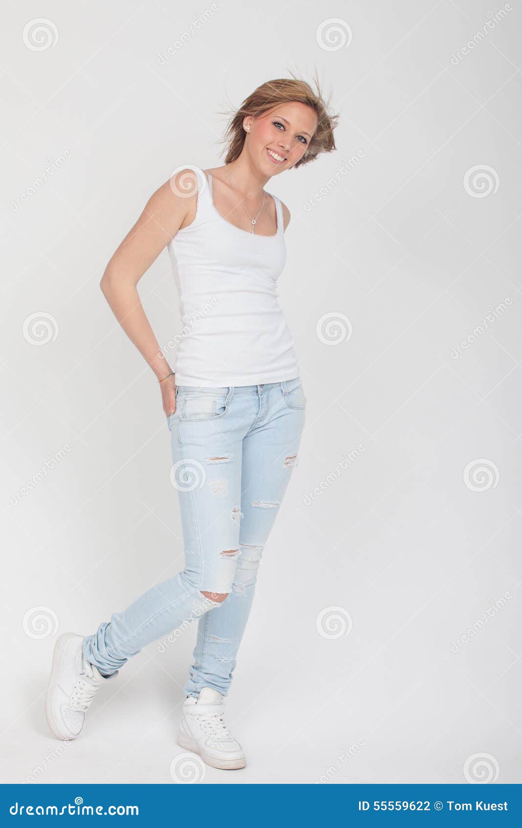 Teenager Girl In Blue Jeans White Shirt And White Sport Shoes P Stock Photo Image Of Shirt Smile