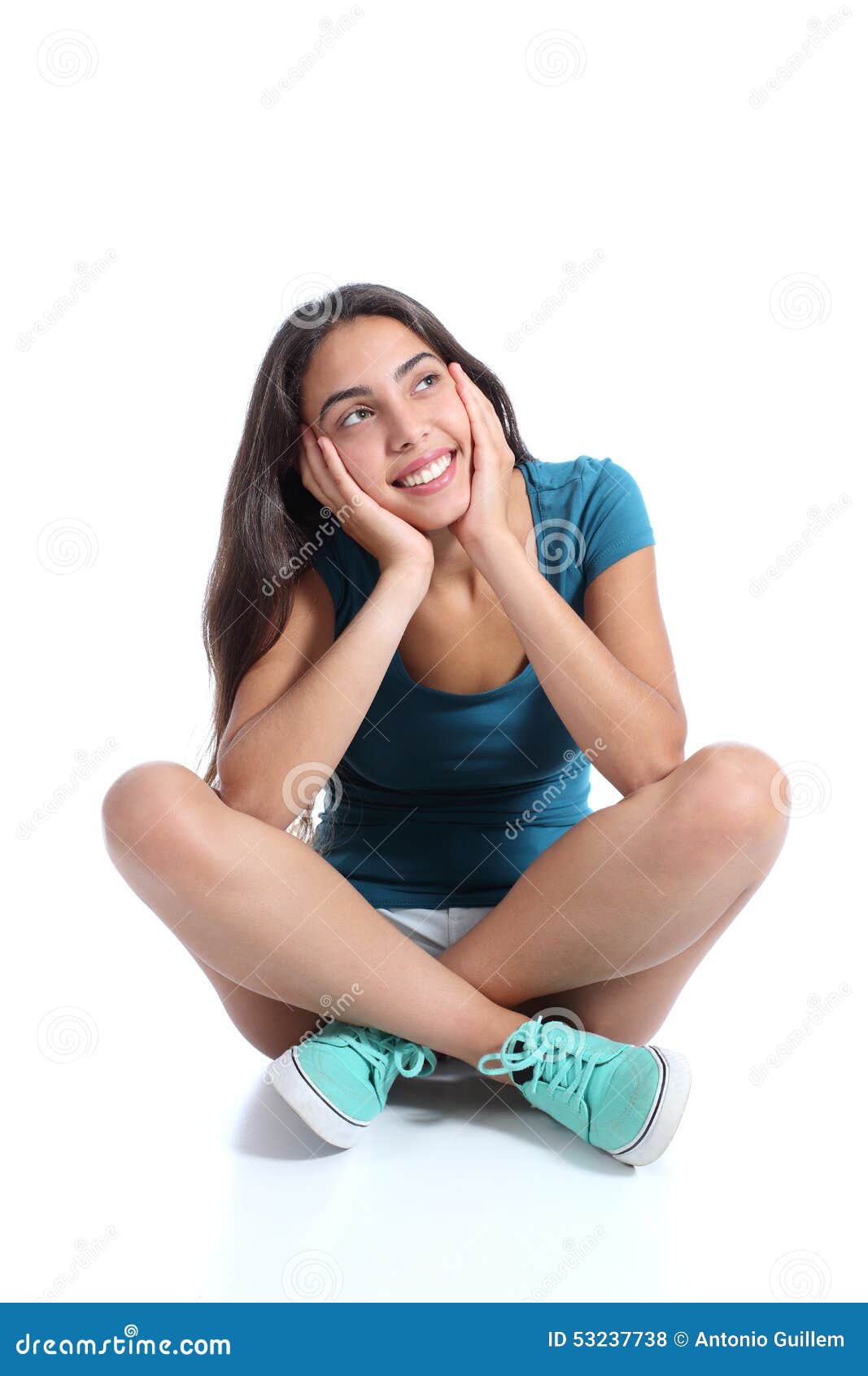 teenager girl sitting and thinking looking sideways