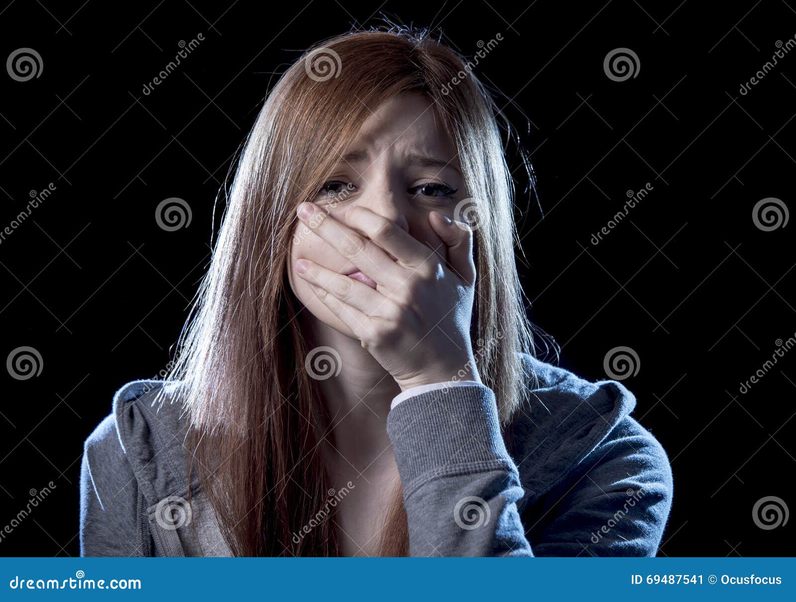 teenager girl in stress and pain suffering depression sad and scared in fear face expression
