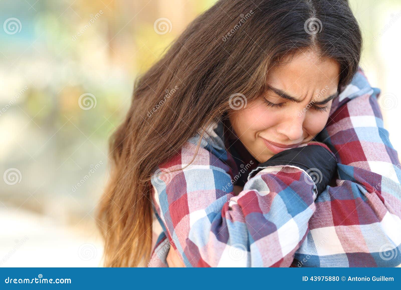 teenager girl worried and sad outdoors