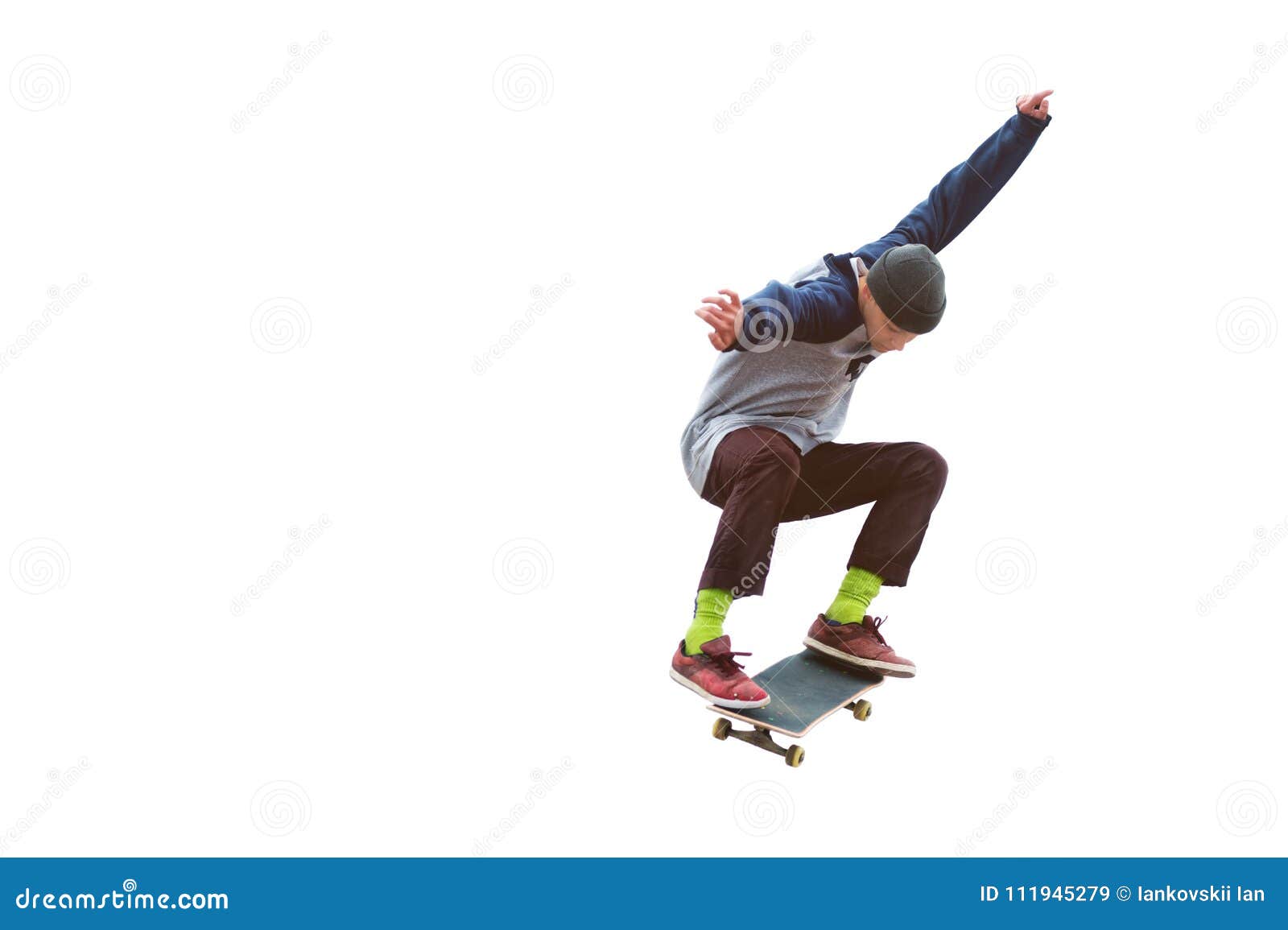 A Teenager Skateboarder Jumps an Ollie on an Isolated White Background ...