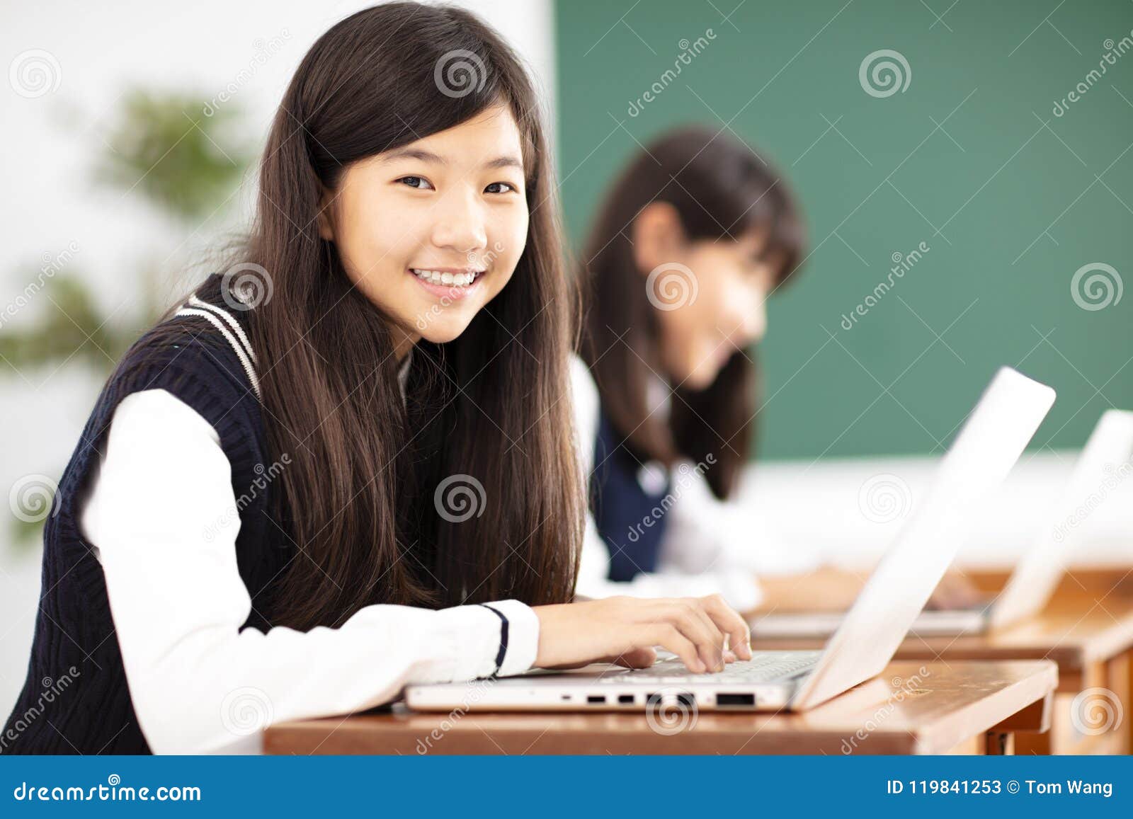 teenager student learning online with laptop in classroom