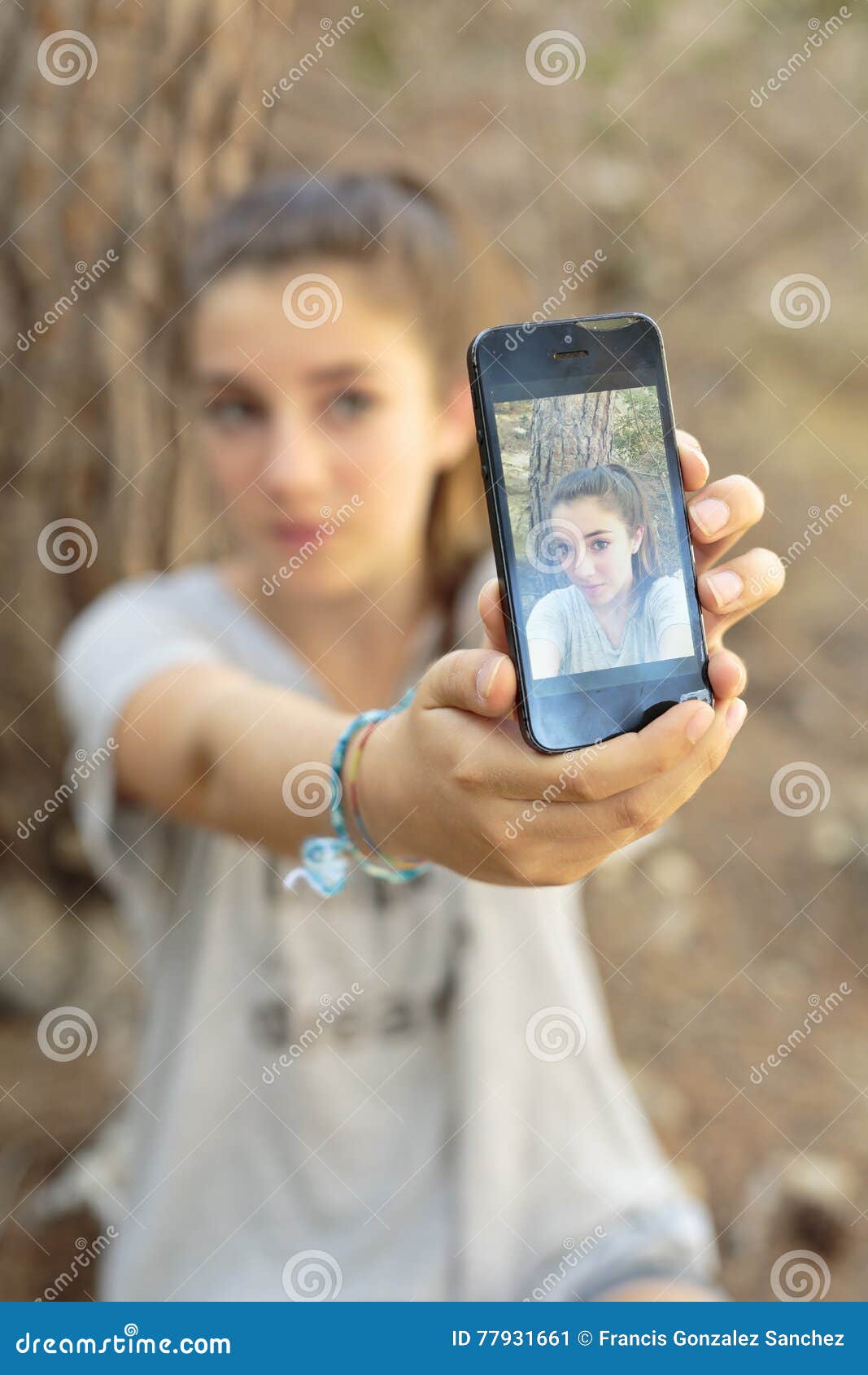 teenager taking photos with your mobile