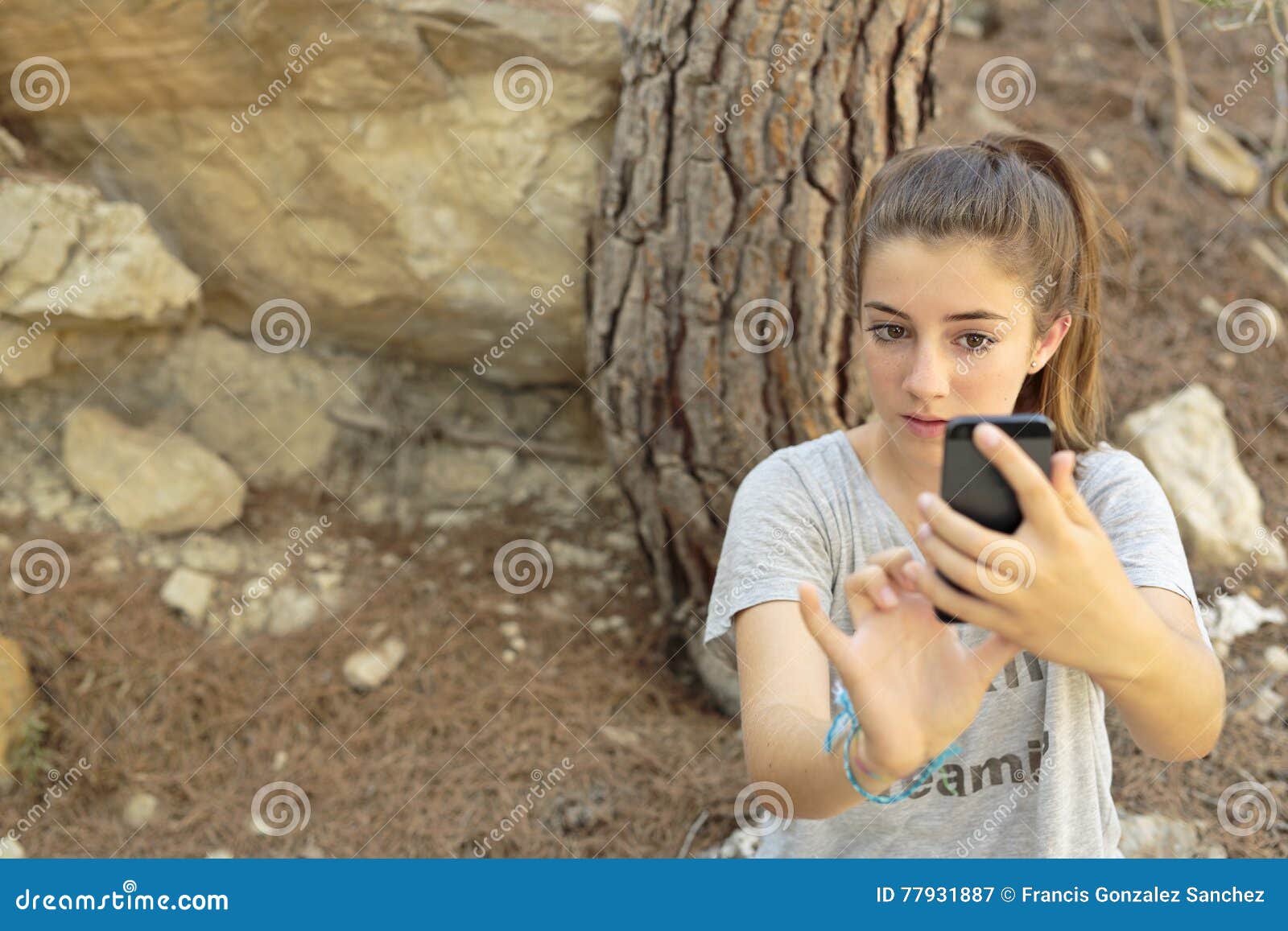 teenager taking photos with your mobile