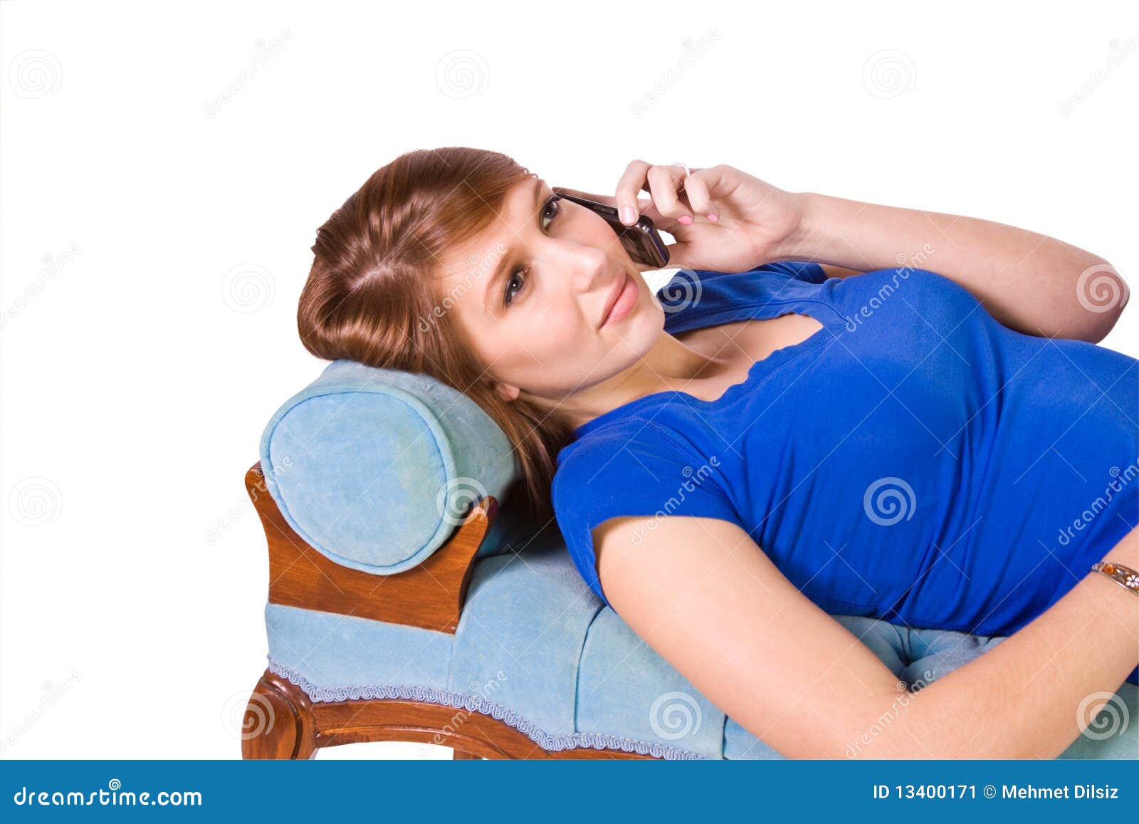 Teenager Talking on the Cell Phone on a Green Couch