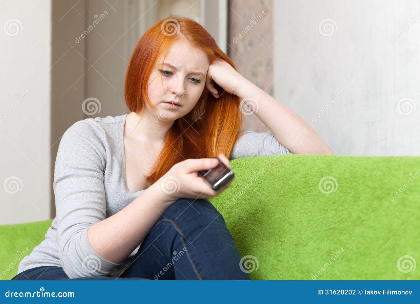 teenager waits telephone call after quarrel